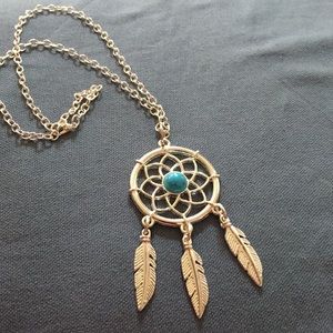 Silvertone dream catcher pendant necklace.